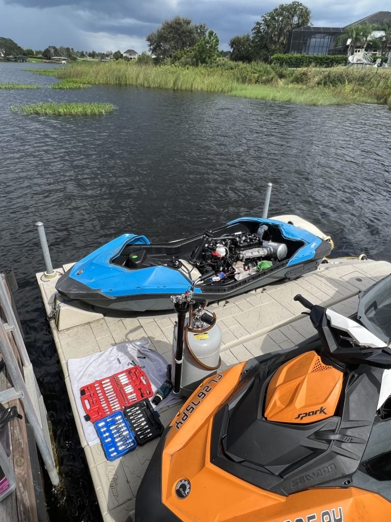 Jet ski getting serviced dockside by Makin Waves Mobile Marine
