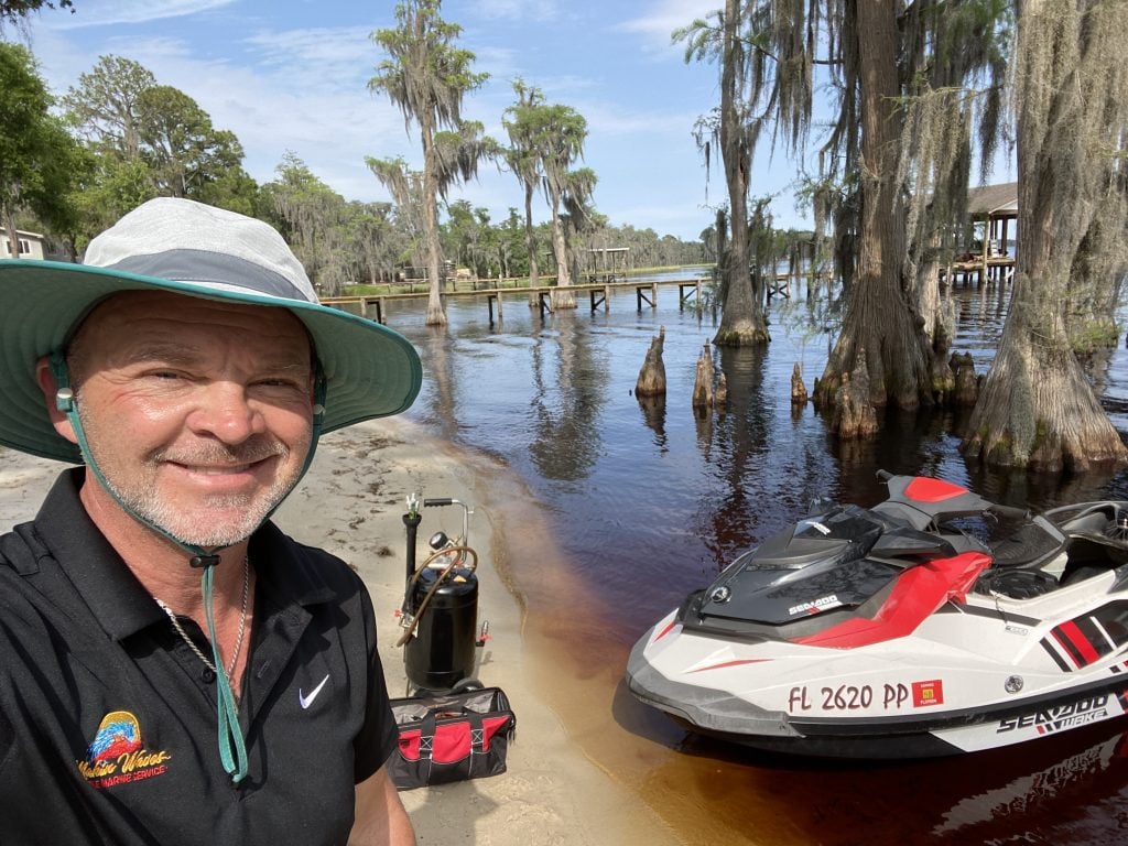 Makin Waves mobile jet ski mechanic servicing a personal watercraft at a customer's dock in Central Florida